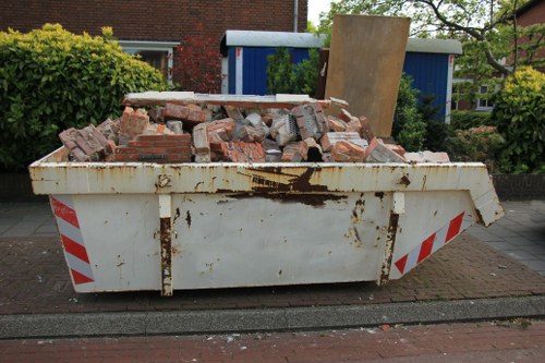 Rubbish clearance team handling household waste removal in London