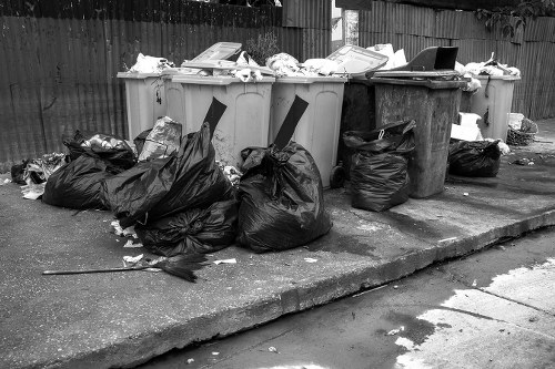 Waste removal team handling household clearance in a London street