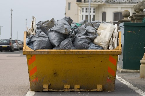 Furniture clearance team handling bulky household items in a London property