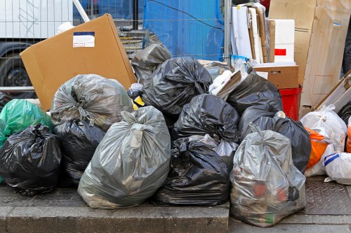 Rubbish removal team collecting mixed waste from a property