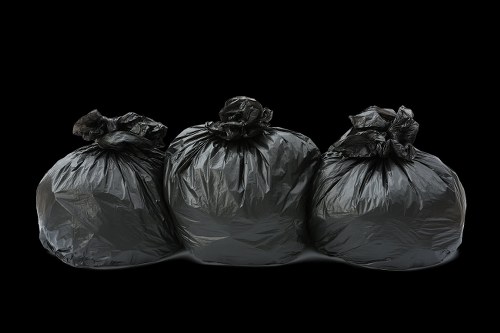 Team assessing waste collection risks during a rubbish removal job