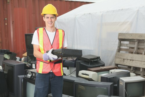 Removed office furniture and equipment ready for sorting and transport